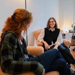 Student and Director of Career Design sitting in the office of Career Design having a discussion. 