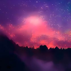 A colorful sunrise or sunset with distant trees and a mountain.